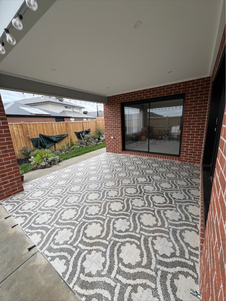 Patterned stone paving on a covered outdoor patio