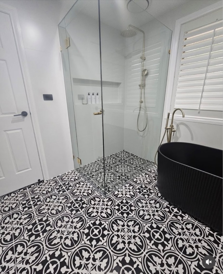 Black and white patterned bathroom floor tiles